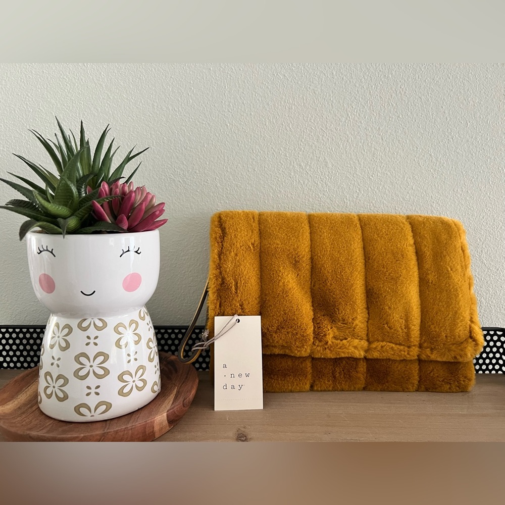 A New Day mustard yellow fur clutch